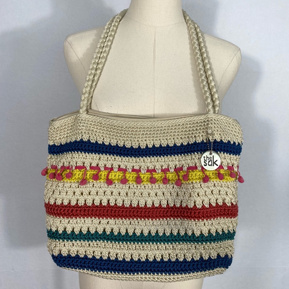 The Sak crocheted striped shoulder bag with pink pom-poms Casual Classics